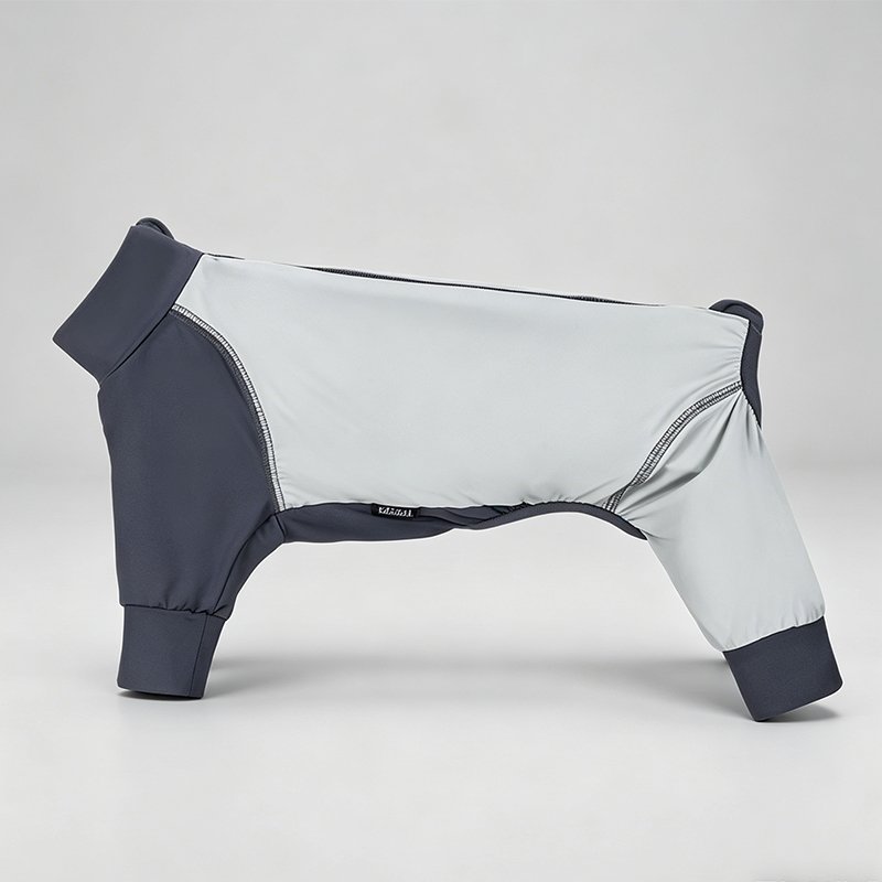 Neutral studio standalone product shot of WoofShield dark charcoal grey & off-white four-legged full coverage UPF 50+ cooling dog sun suit, no dog model