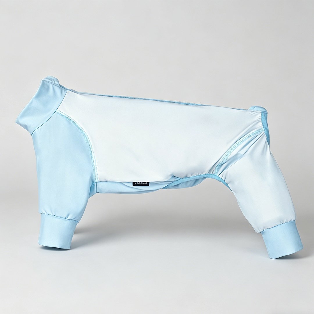 Studio standalone product shot of WoofShield light sky blue four-legged full-coverage dog sun suit, certified UPF 50+ cooling UV protective pet apparel without dog model